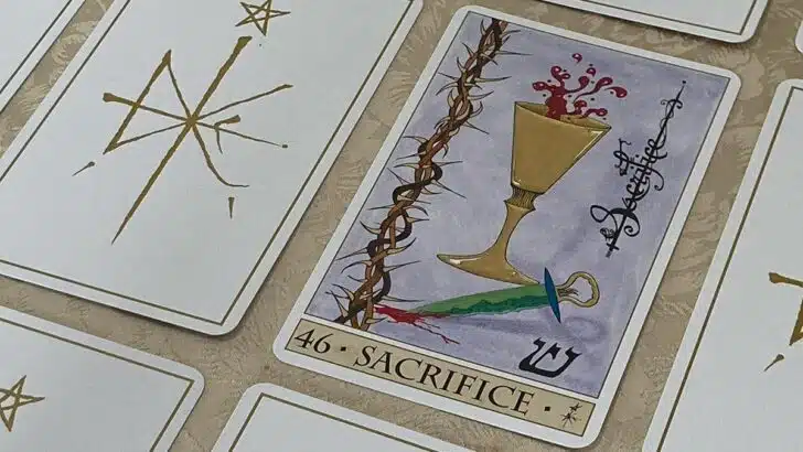 Oracle de la Triade : carte Sacrifice